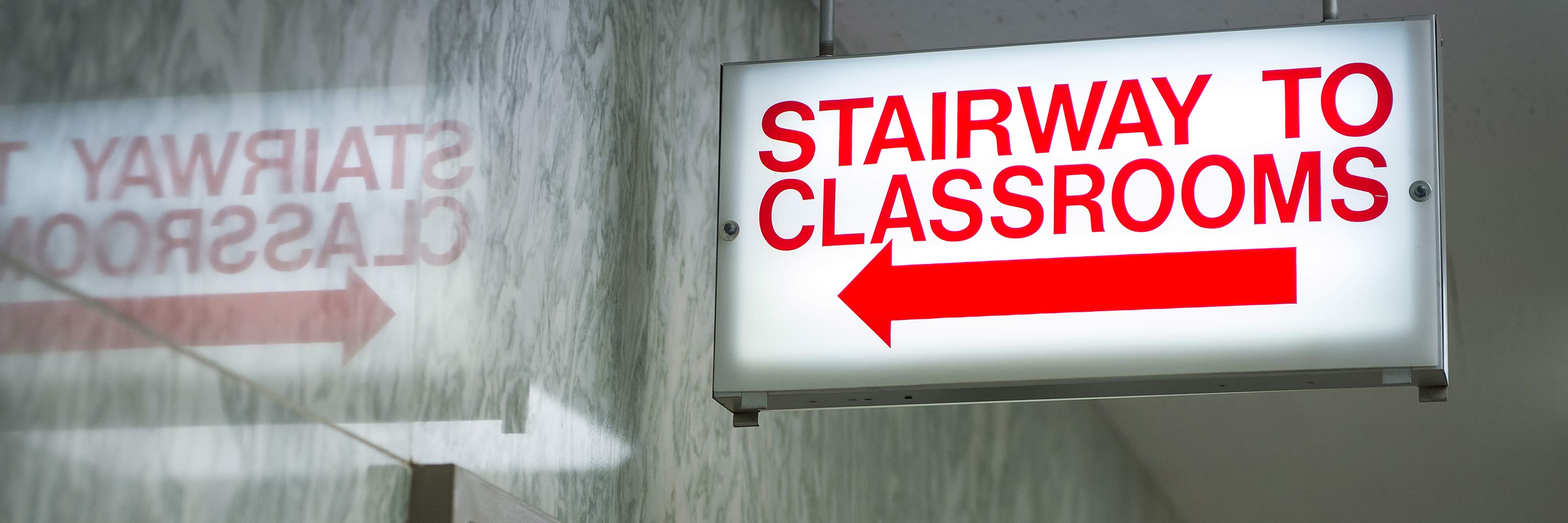 light up sign that says stairway to classrooms