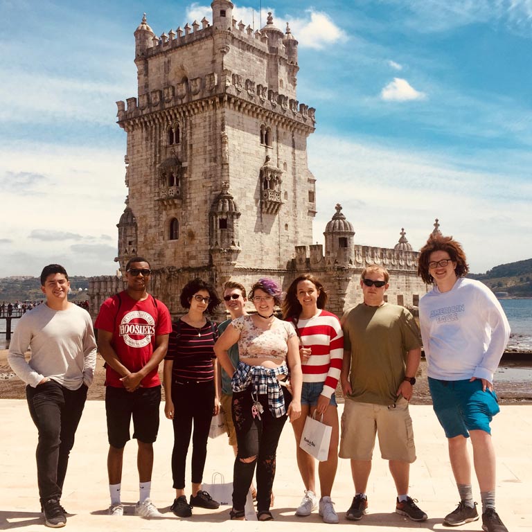 A group of students pose abroad in Lisbon
